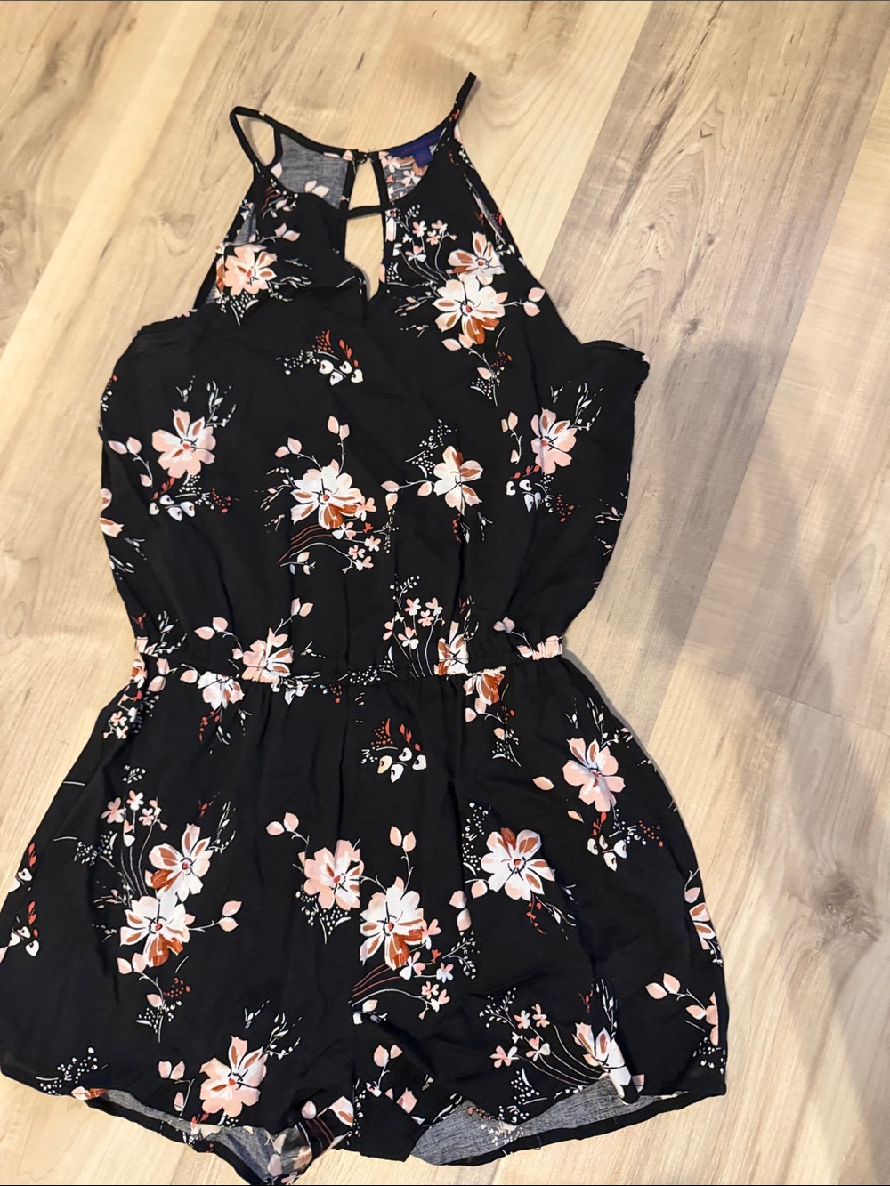 Size small black aeropostale floral romper with cutout detail